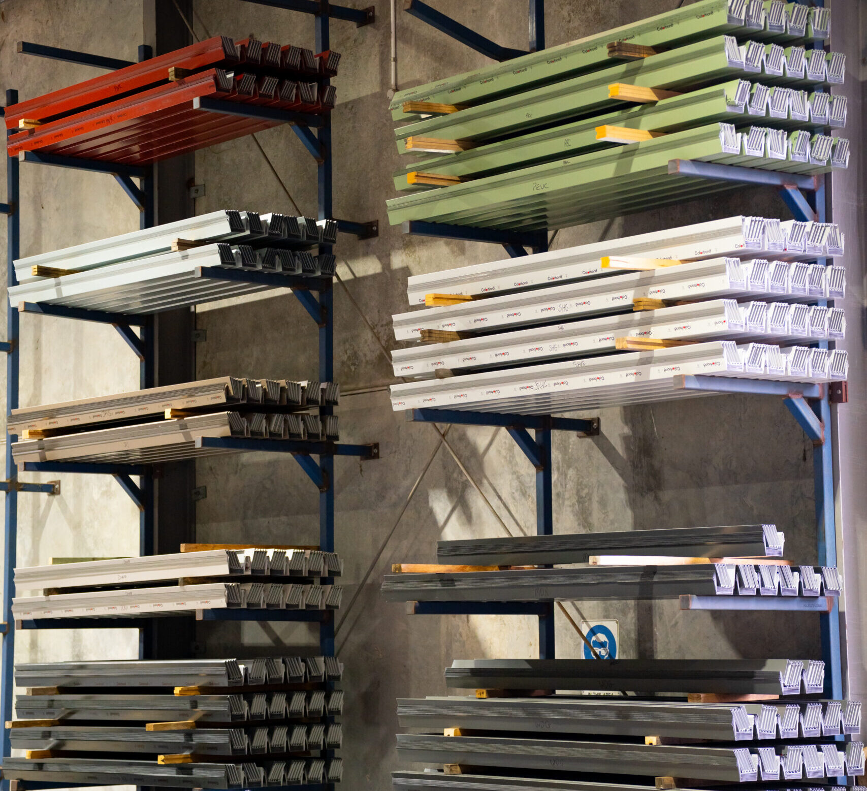 Colorbond coil stock on racks at SRSC Tuggerah, used for custom flashings